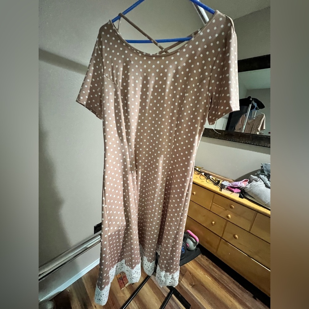 Women’s large polkadot dress with lace ham back has cris cross design